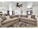 Spacious living room featuring a sectional sofa, stylish rug, and open layout at 1914 W Onza Ave, Mesa, AZ 85202