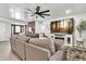 Elegant living room showcasing a sectional sofa, TV, and decorative accents at 1914 W Onza Ave, Mesa, AZ 85202