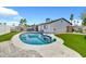 Backyard pool surrounded by green lawn and brick patio, perfect for outdoor enjoyment at 1914 W Onza Ave, Mesa, AZ 85202