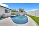 Sparkling backyard pool with blue tile, surrounded by concrete and lush green grass at 1914 W Onza Ave, Mesa, AZ 85202