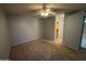 Spacious bedroom with carpet flooring, ceiling fan, and a walk-in closet at 2019 W Lemon Tree Pl # 1124, Chandler, AZ 85224