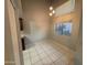 Dining area featuring tiled floors, a window with a view, and modern lighting at 2019 W Lemon Tree Pl # 1124, Chandler, AZ 85224