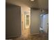 Neutral hallway showcasing multiple doorways to rooms at 2019 W Lemon Tree Pl # 1124, Chandler, AZ 85224