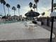 Community pool with lounge area and an umbrella, perfect for relaxation at 2019 W Lemon Tree Pl # 1124, Chandler, AZ 85224