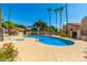 Community pool and deck area with ample seating and a clear blue pool at 2019 W Lemon Tree Pl # 1124, Chandler, AZ 85224