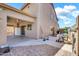 View of the covered patio with ceiling fans, an outdoor fridge, and pavers at 21054 N Sansom Dr, Maricopa, AZ 85138