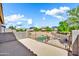 Balcony overlooking backyard pool with black metal fence and block wall at 21054 N Sansom Dr, Maricopa, AZ 85138