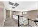 Upstairs hallway with natural light, carpeted floors, and white banister at 21054 N Sansom Dr, Maricopa, AZ 85138