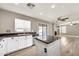 Bright kitchen featuring a central island, modern appliances, and backyard views at 21054 N Sansom Dr, Maricopa, AZ 85138