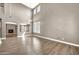 Spacious living room with vaulted ceilings, wood flooring, and natural light at 21054 N Sansom Dr, Maricopa, AZ 85138