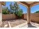 View of the backyard patio, rock landscaping, greenery, and a block fence at 21059 E Pickett St, Queen Creek, AZ 85142