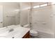 This bathroom offers a single sink vanity, a mirror, a tub, and a shower with tile surround at 21059 E Pickett St, Queen Creek, AZ 85142