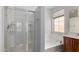 Bathroom featuring a shower, soaking tub, and a light-filled window above the tub at 21059 E Pickett St, Queen Creek, AZ 85142