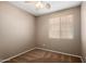 This bedroom is equipped with a ceiling fan, neutral paint color, and carpeted floors at 21059 E Pickett St, Queen Creek, AZ 85142