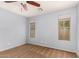Serene bedroom with neutral carpet, two windows, and a ceiling fan at 21059 E Pickett St, Queen Creek, AZ 85142