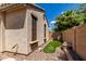 Exterior view of the home showcasing rock landscaping and artificial grass at 21059 E Pickett St, Queen Creek, AZ 85142
