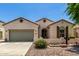 Charming single-story home with a two-car garage and desert landscaping at 21059 E Pickett St, Queen Creek, AZ 85142