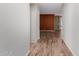 Hallway with wood-look floors leading to other living spaces at 21059 E Pickett St, Queen Creek, AZ 85142
