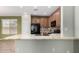 Kitchen with stone counters, tile backsplash, black appliances, and breakfast bar at 21059 E Pickett St, Queen Creek, AZ 85142