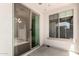 The back patio offers a sliding glass door and a large window for ample natural lighting at 21059 E Pickett St, Queen Creek, AZ 85142