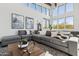 Comfortable common room featuring high ceilings, large windows, and sectional seating at 21244 N 58Th St, Phoenix, AZ 85054