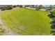 Expansive green open space beside a community pool, perfect for outdoor activities and relaxation at 21244 N 58Th St, Phoenix, AZ 85054