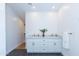 Bright bathroom featuring a double vanity with marble countertops and modern fixtures at 214 W Ruth Ave, Phoenix, AZ 85021