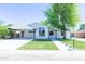 Charming single-story home with a well-manicured lawn and a covered parking area at 214 W Ruth Ave, Phoenix, AZ 85021