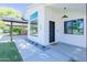 Charming front entrance featuring modern design with a black door, sleek lighting, and tasteful landscaping at 214 W Ruth Ave, Phoenix, AZ 85021