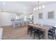 Modern kitchen with an island, barstool seating, stainless appliances, and hardwood flooring at 214 W Ruth Ave, Phoenix, AZ 85021
