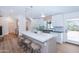 Well-lit kitchen featuring a large island, breakfast bar, stainless steel range, and ample storage at 214 W Ruth Ave, Phoenix, AZ 85021