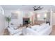 Open-concept living room with modern decor, a cozy fireplace, and plenty of natural light for a comfortable atmosphere at 214 W Ruth Ave, Phoenix, AZ 85021