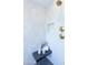 Bright shower featuring a modern design, black tile flooring, gold fixtures, and white tiled walls at 214 W Ruth Ave, Phoenix, AZ 85021