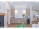 Stylish wet bar with custom cabinets, marble countertops, wine fridge, and decorative tile backsplash at 214 W Ruth Ave, Phoenix, AZ 85021