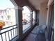 Cozy balcony with wrought iron railing offering views of the neighborhood with seating to enjoy your day at 2150 W Alameda Rd # 2037, Phoenix, AZ 85085