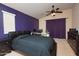 Bedroom with a ceiling fan, black furniture, and a workspace at 2150 W Alameda Rd # 2037, Phoenix, AZ 85085