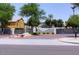 Community entrance featuring a secure gate, well manicured landscaping, and updated signage at 2150 W Alameda Rd # 2037, Phoenix, AZ 85085