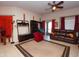 Open living room featuring tile flooring, a brown leather couch and balcony access at 2150 W Alameda Rd # 2037, Phoenix, AZ 85085