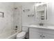 This bathroom features modern fixtures, marble tiled shower, and decorative shelving at 2223 E Crest Ln, Phoenix, AZ 85024
