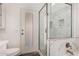 Bright bathroom shows marble tiled shower with glass door and white vanity at 2223 E Crest Ln, Phoenix, AZ 85024