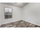 This bedroom features a double hung window, new flooring, and neutral walls at 2223 E Crest Ln, Phoenix, AZ 85024