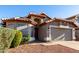 Charming single-story home with a well-manicured front yard and a spacious two-car garage at 2223 E Crest Ln, Phoenix, AZ 85024