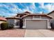 Charming single-story home with a well-manicured front yard and a spacious two-car garage at 2223 E Crest Ln, Phoenix, AZ 85024