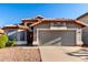 Charming single-story home with a well-manicured front yard and a spacious two-car garage at 2223 E Crest Ln, Phoenix, AZ 85024