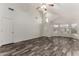 Bright, open living room featuring wood-look floors, vaulted ceiling, and plenty of natural light at 2223 E Crest Ln, Phoenix, AZ 85024