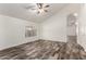 Bright, open living room featuring wood-look floors, vaulted ceiling, and plenty of natural light at 2223 E Crest Ln, Phoenix, AZ 85024