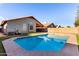 Inviting backyard pool with concrete surround and well-maintained landscaping at 2223 E Crest Ln, Phoenix, AZ 85024