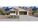 Charming single-story home with desert landscaping and a two-car garage, set against a scenic mountain backdrop at 22530 N Lynn St, Maricopa, AZ 85138