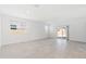 Bright and airy living area with tile floors, natural light, and sliding glass doors at 22530 N Lynn St, Maricopa, AZ 85138