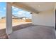 Enjoy the outdoors on this covered patio with views of the backyard and neighborhood at 22530 N Lynn St, Maricopa, AZ 85138